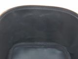 the inside of a black purse with a gold zipper