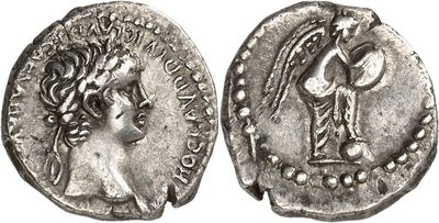 a silver coin with an image of a woman on it