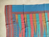 an image of a colorful scarf on the floor