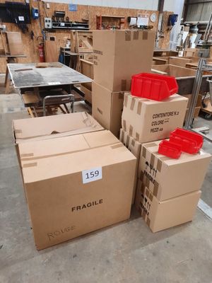 many boxes stacked on top of each other in a warehouse
