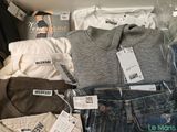 a lot of clothes that are on display in the store