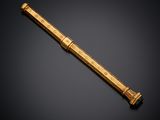 a gold - plated telescope on a black background
