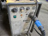 a machine that is sitting on the ground in the garage