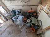 a pile of trash in the corner of a room
