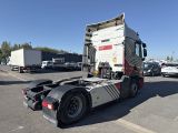 a semi truck that is parked in a parking lot