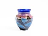 a blue and purple vase sitting on a white surface