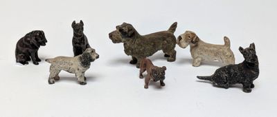 a lot of small toy dogs that are on a white surface