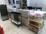 a desk with drawers and shelves in a room