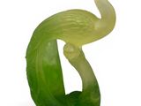 an image of a green sculpture of a bird on top of a leaf