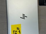 a picture of a notepad and a laptop on a desk