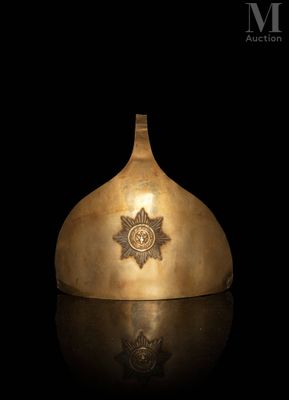 an image of a gold helmet with a star on it