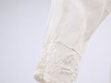 a close up of a pair of white gloves on a mannequin mannequin mannequin mannequin mannequin mannequin mann