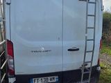 a white van that is parked on the side of the road