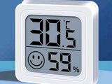 a digital clock with a smiley face on it