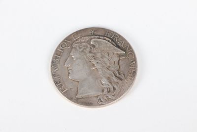 a close up of a coin on a white surface