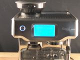 a coffee machine that is sitting on a wooden table