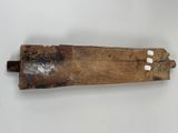 an old wooden piece of wood with a piece of wood sticking out of it