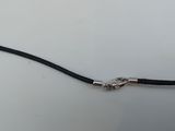 a close up of a black cord with a silver clasp on it