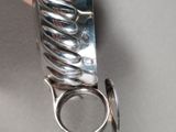 a person holding a pair of scissors in their hand