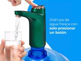 someone is filling a glass of water from a water dispenser