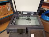 a printer sitting on top of a table in a room