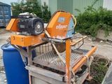a machine that is sitting on a cart in the dirt