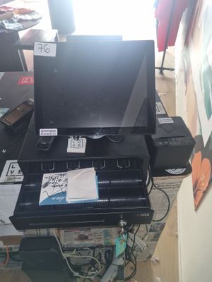 a black printer sitting on top of a desk next to a window