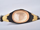 a black and gold hat with a gold trim