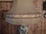 a lamp that is sitting on a table in a room