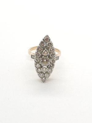 a close up of a diamond ring on a white surface