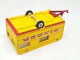 a yellow toy bus with a red roof and wheels
