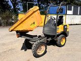 a small yellow dump truck parked in a parking lot