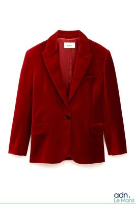 the jacket is red and has a black button on the lapel