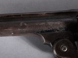 a close up of a gun that is on a table