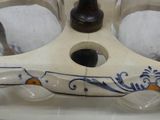 a glass candle holder with a blue and white design on it