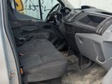 the interior of a truck with the door open and the driver ' s seat down