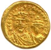une image d'une pièce d'or sur fond blanc