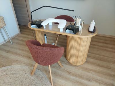 a desk with a chair and a mirror in the room
