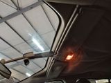 an image of a car with a red light in the passenger seat