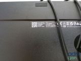 the back of a laptop with a cable connected to it