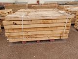 several stacks of wooden planks stacked on top of each other