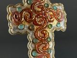 an image of a cross made out of glass beads