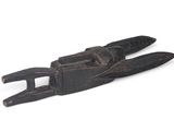 a black object that is sitting on a white surface