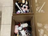 a cardboard box filled with various items on the floor