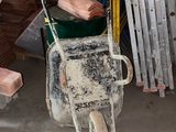 a wheelbarrow that is sitting in a garage