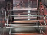 an image of a stainless steel oven with a rack of food inside of it