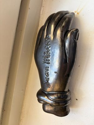 a statue of a hand that is on the wall