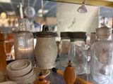 many glass jars on the counter in the kitchen