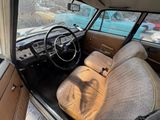 a view of the inside of a car from the driver ' s seat