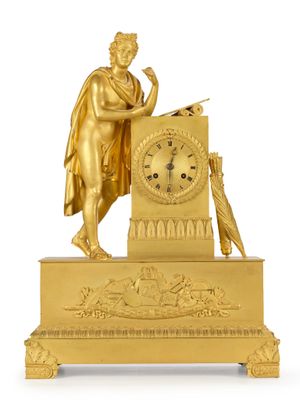 an image of a gold clock with a statue of a man holding a sword